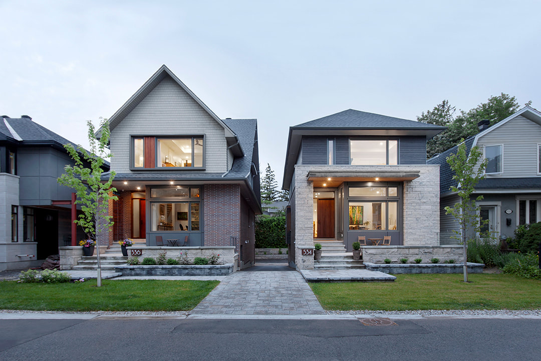 infill housing development lit up at dusk in ottawa by hobin architecture, krista jahnke photography