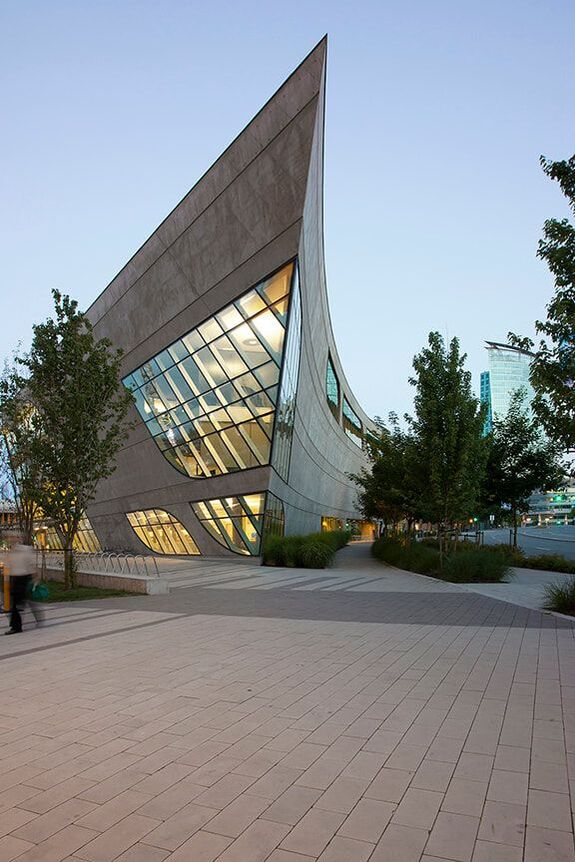 surrey library lit up at dusk by bing thom architects, krista jahnke photography