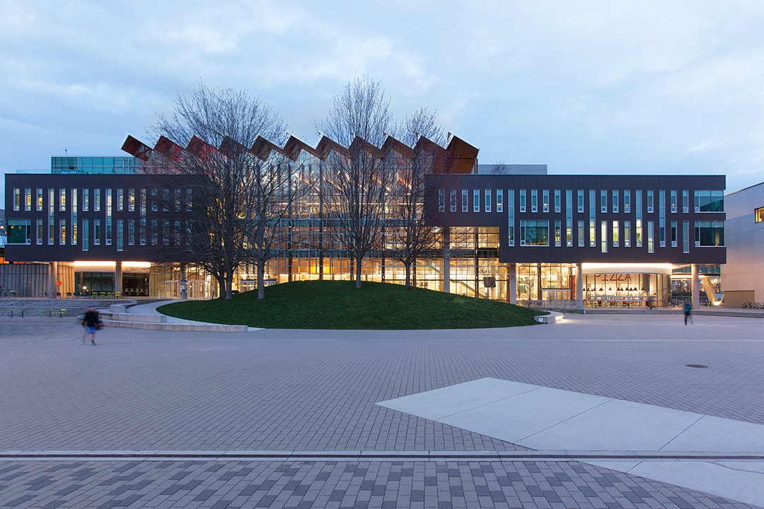 student union building lit up at dusk at university of british columbia in vancouver by dialog architects and b+h architects, krista jahnke photography