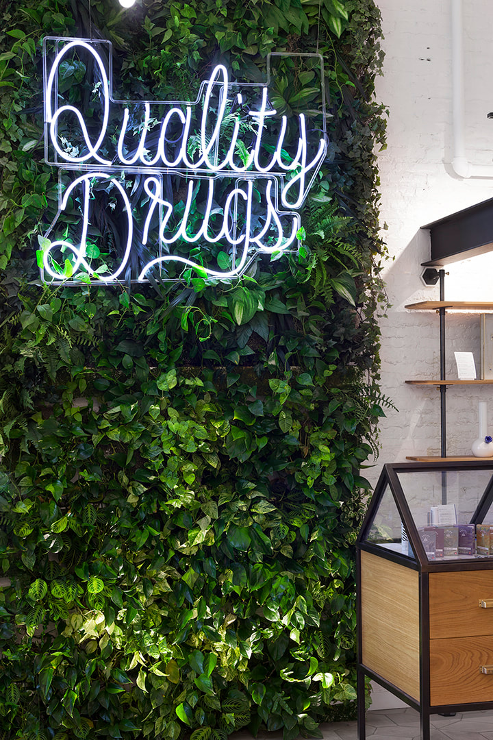 green wall at serra canabis dispensary by designers omfgco in portland oregon, krista jahnke photography