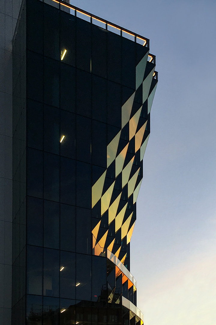 solar carve office building at dusk in new york city by architecture firm studio gang, krista jahnke photography