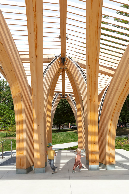 kids playing at the st. james park pavilion by architecture firm raw design in toronto, ontario