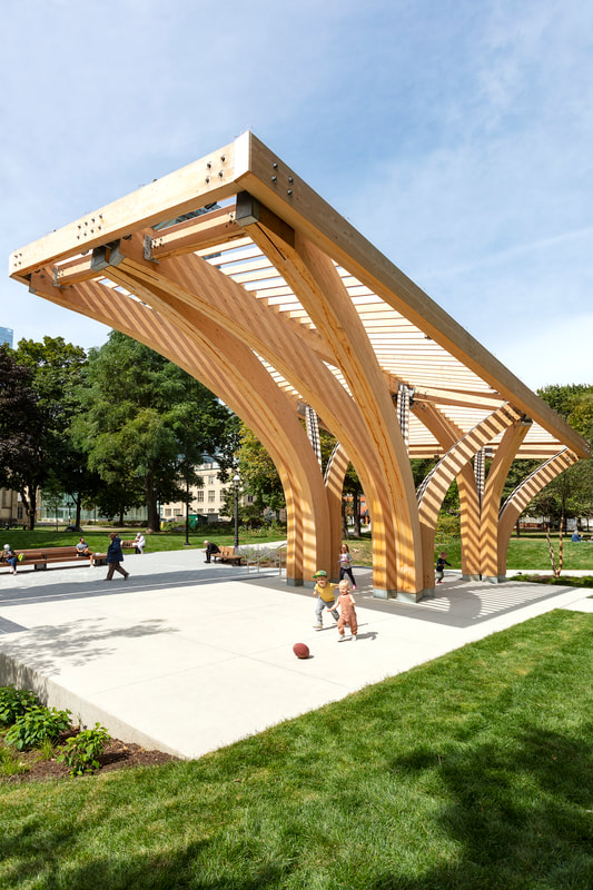 kids playing at the st. james park pavilion by architecture firm raw design in toronto, ontario