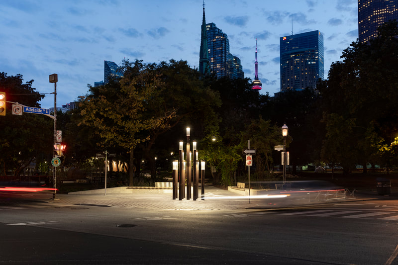 st. james park lighting installation at dusk by pma landscape architects in toronto, ontario